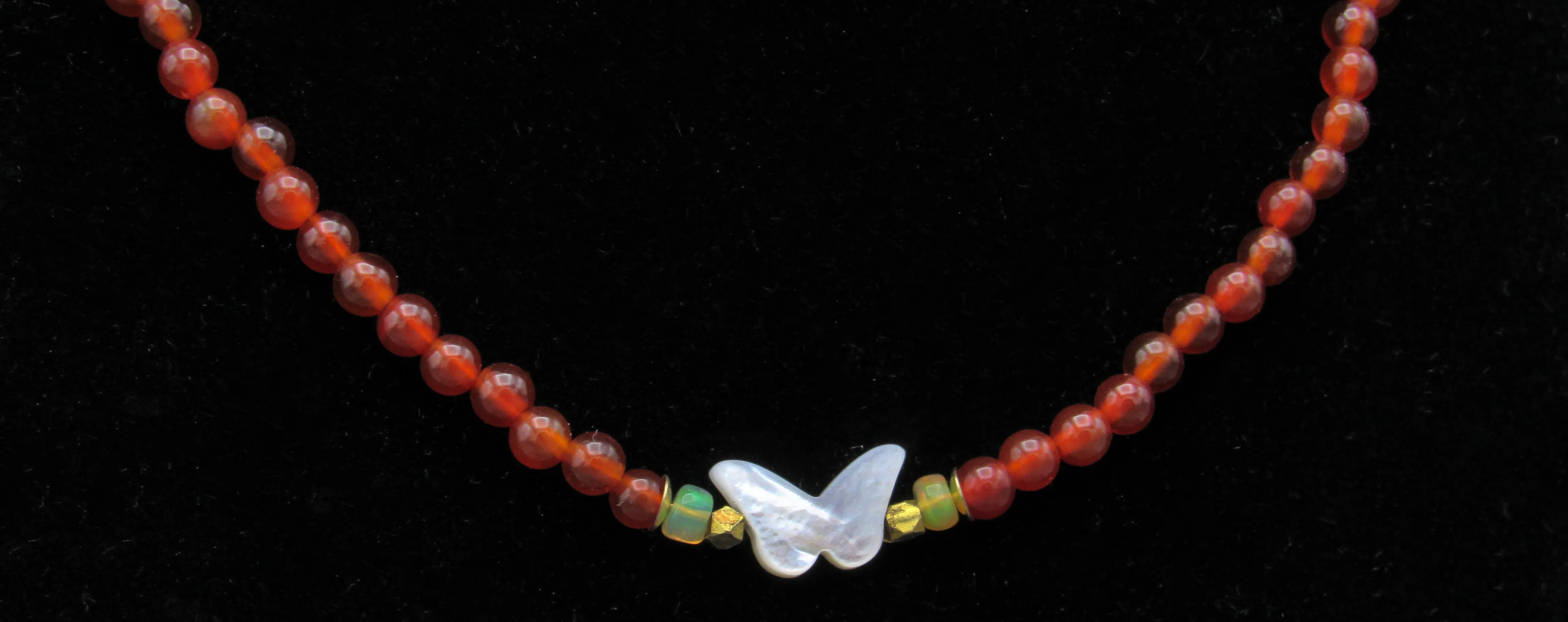 Mother of Pearl Butterfly, Red Onyx gemstone, and Ethiopian Fire opals w/ 14 kt gf Components